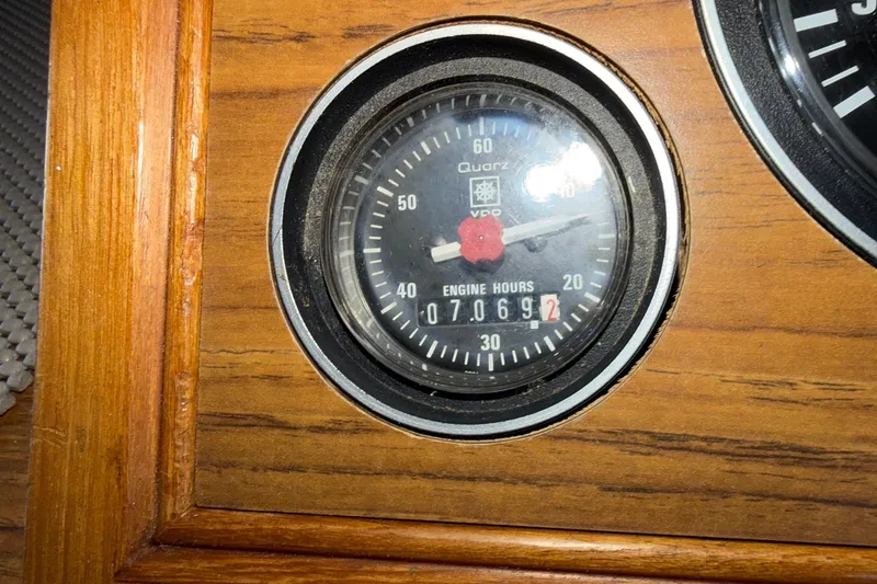 Slide: The Image of Engine hour meter on 1988 Grand Banks 42 Classic, showing 7069.2 hours. - 35