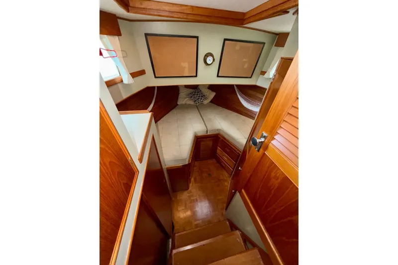 Slide: The Image of Cozy cabin interior of 1988 Grand Banks 42 Classic yacht with wooden finishes. - 46