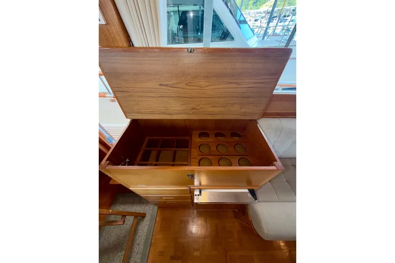 Slide: The Image of Open wooden storage compartment on 1988 Grand Banks 42 Classic yacht interior. - 43