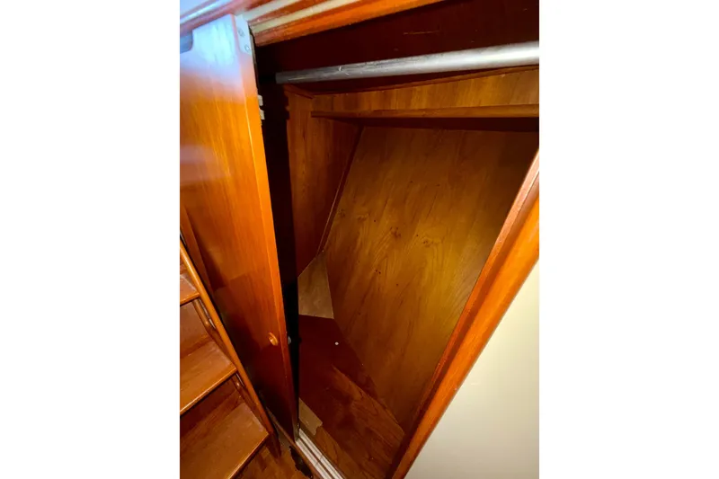 Slide: The Image of Wooden closet interior on a 1988 Grand Banks 42 Classic yacht. - 51