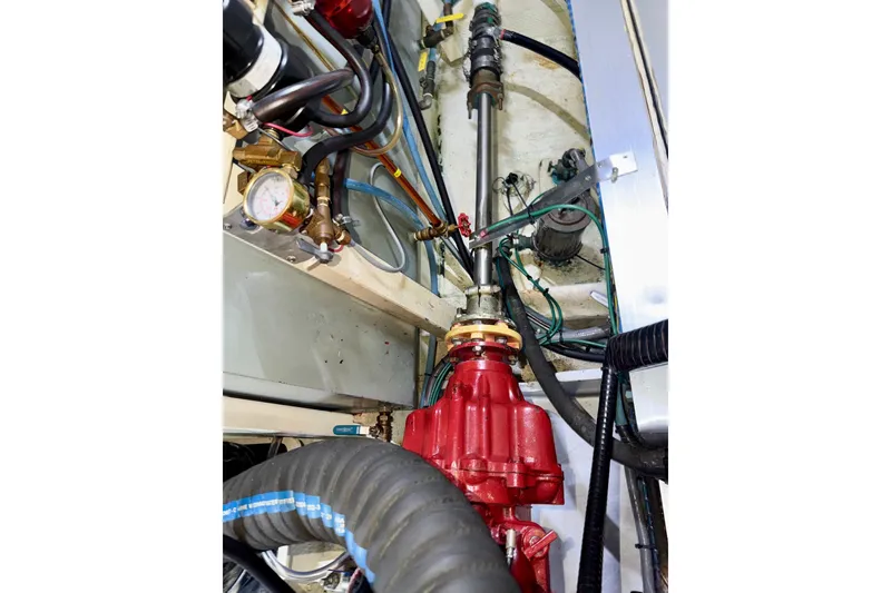 Slide: The Image of Engine room of 1988 Grand Banks 42 Classic, showcasing mechanical components and wiring. - 81