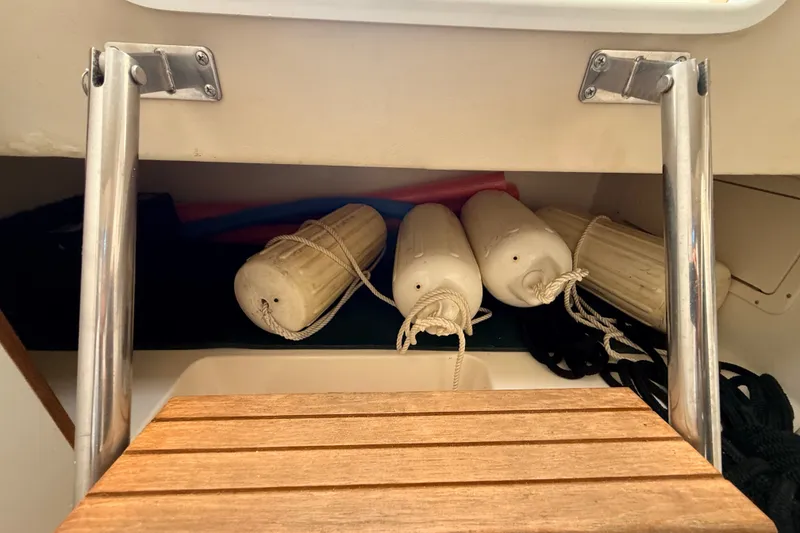 Slide: The Image of Storage area on a 1999 Pursuit 2860 Denali boat with fenders and ropes. - 22