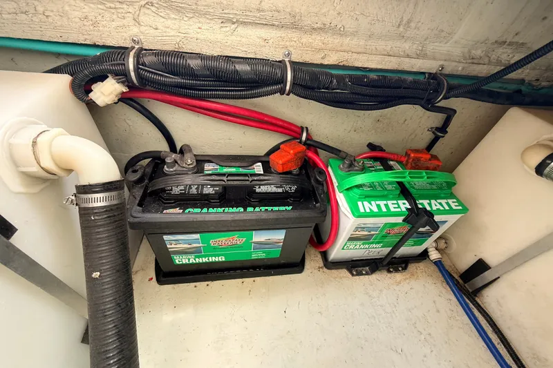 Slide: The Image of Marine batteries in a 1999 Pursuit 2860 Denali boat engine compartment. - 21