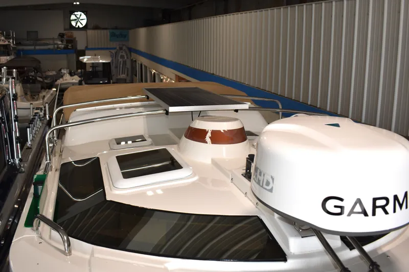 Slide: The Image of 2019 Ranger Tugs R-23 boat with Garmin radar and solar panel in a showroom. - 42