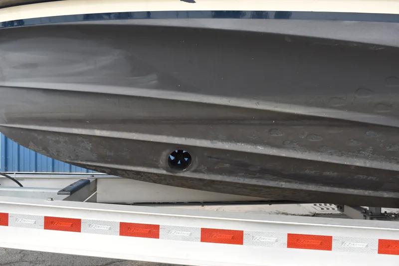 Slide: The Image of 2019 Ranger Tugs R-23 boat hull on trailer, showcasing sleek design and craftsmanship. - 11