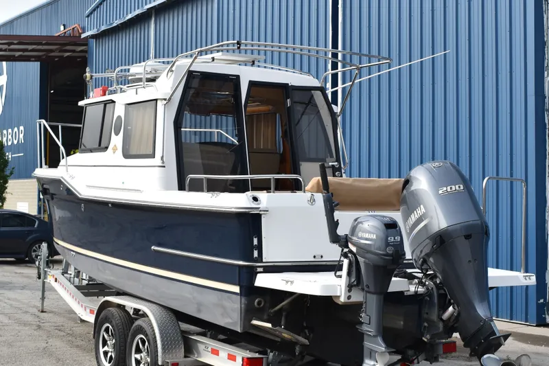Slide: The Image of 2019 Ranger Tugs R-23 boat with Yamaha engines on a trailer. - 2