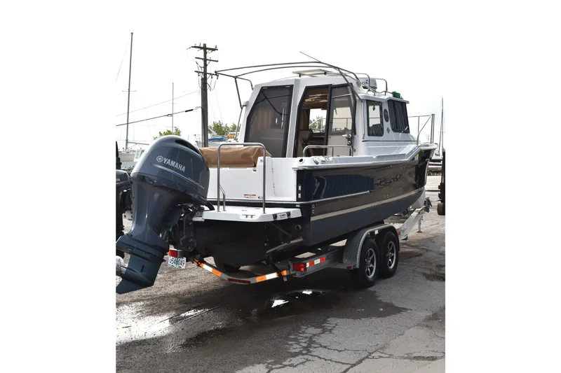 Slide: The Image of 2019 Ranger Tugs R-23 boat on trailer with Yamaha outboard motor. - 3