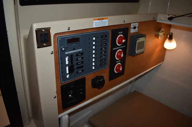 Slide: The Image of Control panel of a 2019 Ranger Tugs R-23 boat with switches and gauges. - 27