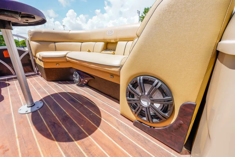 Slide: The Image of Luxurious seating on 2016 South Bay 724 SPORT DLX pontoon boat with stylish speaker system. - 33