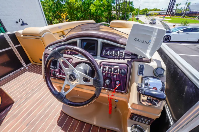 Slide: The Image of Steering console of 2016 South Bay 724 SPORT DLX boat with Garmin navigation system. - 32