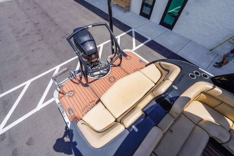 Slide: The Image of 2016 South Bay 724 SPORT DLX boat with Suzuki 300 engine, beige seating, and teak deck. - 26