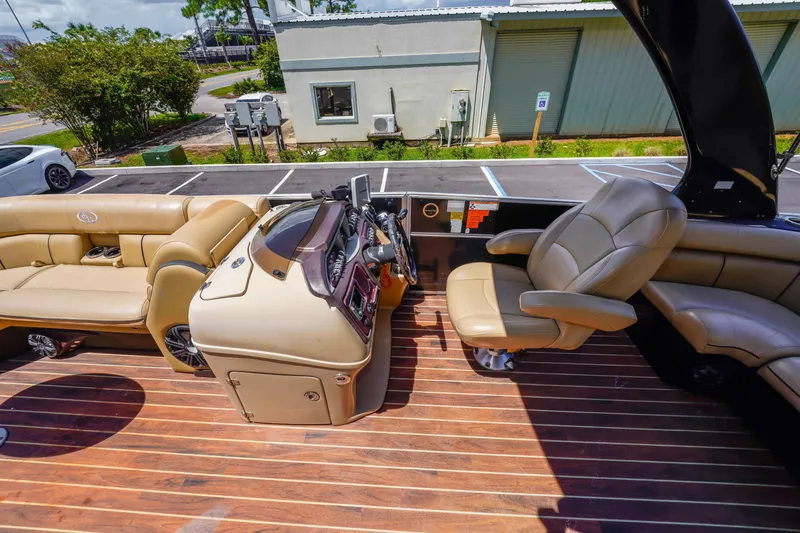 Slide: The Image of 2016 South Bay 724 SPORT DLX boat interior with luxurious seating and modern dashboard. - 21