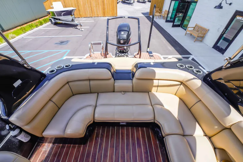Slide: The Image of Luxurious seating on 2016 South Bay 724 SPORT DLX boat, featuring tan upholstery and sleek design. - 24
