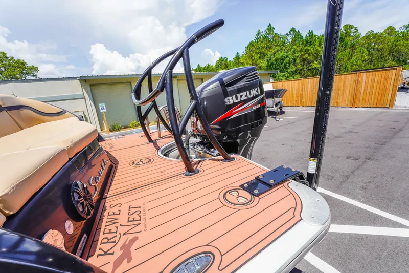 Slide: The Image of 2016 South Bay 724 SPORT DLX boat with Suzuki outboard motor in parking lot. - 16