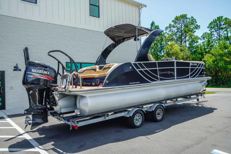Slide: The Image of 2016 South Bay 724 SPORT DLX pontoon boat on trailer with Suzuki outboard motor. - 3