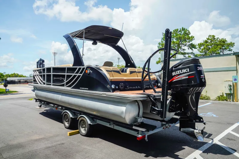 Slide: The Image of 2016 South Bay 724 SPORT DLX pontoon boat with Suzuki 300 engine on trailer. - 5