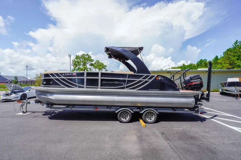 Slide: The Image of 2016 South Bay 724 SPORT DLX pontoon boat on trailer, parked outdoors. - 34