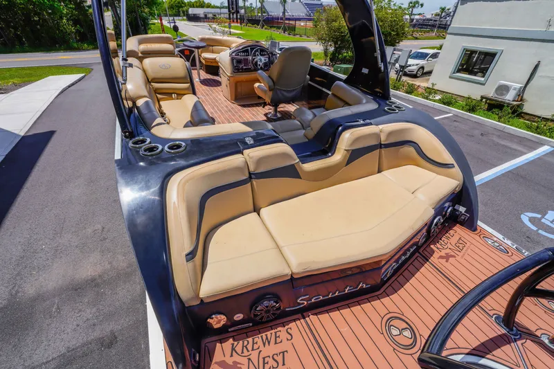 Slide: The Image of Luxurious 2016 South Bay 724 SPORT DLX pontoon boat with plush seating and sleek design. - 27