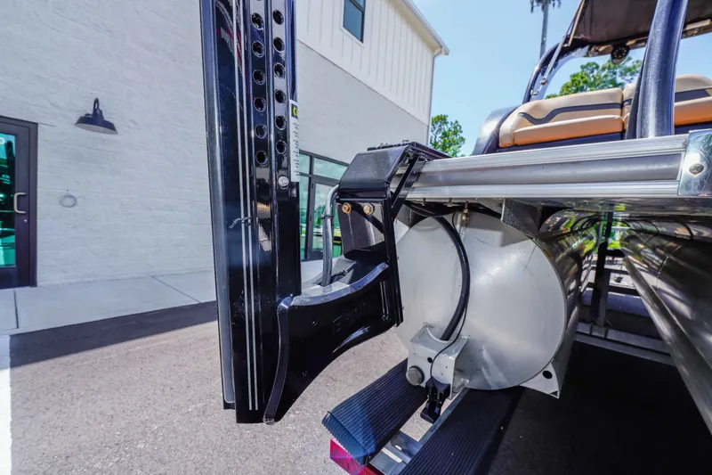 Slide: The Image of 2016 South Bay 724 SPORT DLX pontoon boat detail, showcasing rear structure and seating. - 35