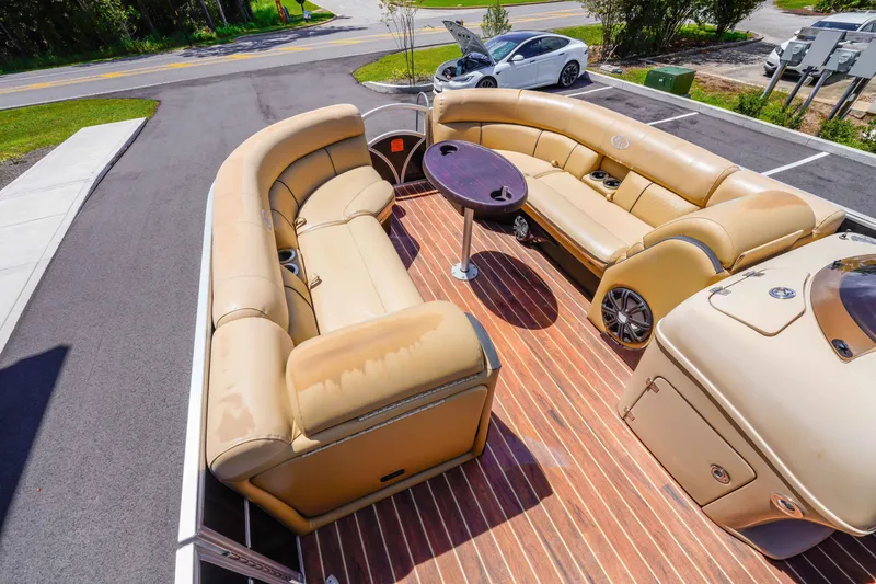 Slide: The Image of Luxurious 2016 South Bay 724 SPORT DLX pontoon boat with tan seating and wood-style flooring. - 19