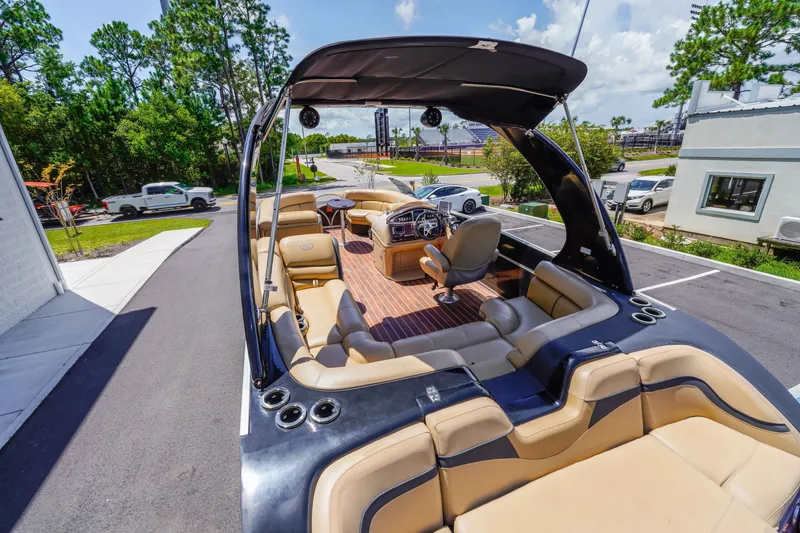 Slide: The Image of 2016 South Bay 724 SPORT DLX pontoon boat with luxurious seating and sleek design. - 29