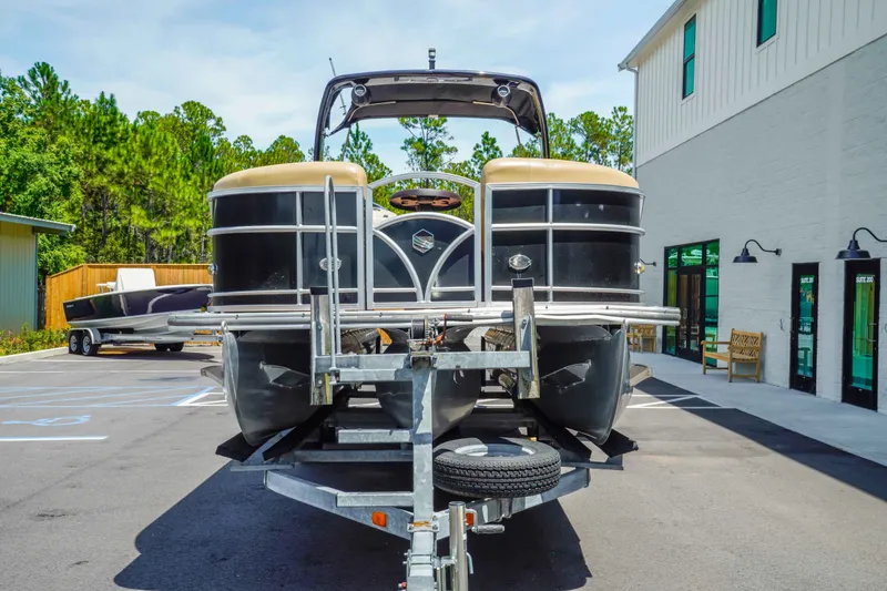 Slide: The Image of 2016 South Bay 724 SPORT DLX pontoon boat on trailer in parking lot. - 7
