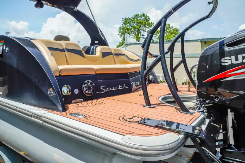 Slide: The Image of 2016 South Bay 724 SPORT DLX pontoon boat with Suzuki engine, featuring tan seating and sleek design. - 9