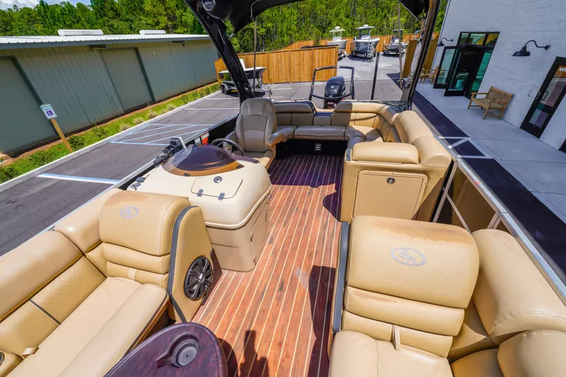 Slide: The Image of 2016 South Bay 724 SPORT DLX pontoon boat with luxurious tan seating and wood-style flooring. - 20
