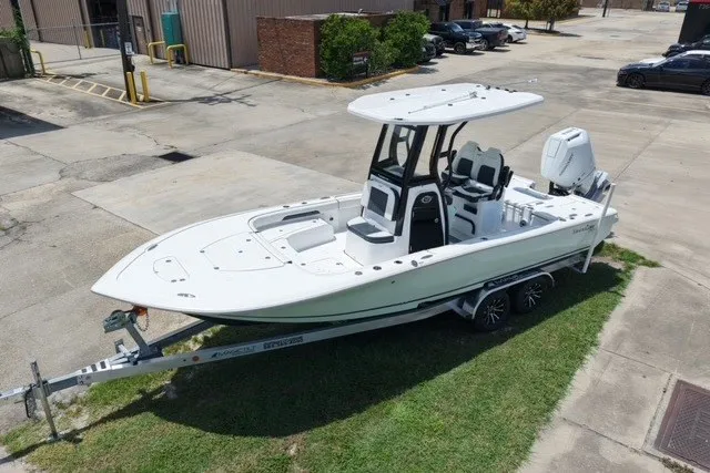 Slide: The Image of 2027 Tidewater 2500 Carolina Bay boat on trailer, parked outdoors. - 3