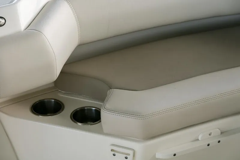 Slide: The Image of Manufacturer Provided Image: 2025 Boston Whaler 250 Outrage interior seating with cup holders. - 18
