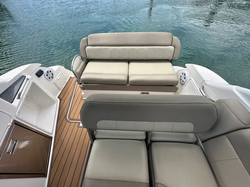 Slide: The Image of The image shows the cockpit of a 2014 Regal 30 Express with beige upholstered seating. - 11