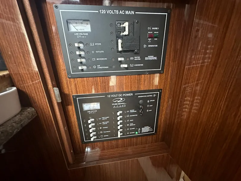 Slide: The Image of Electrical panel setup in a 2014 Regal 30 Express. - 27