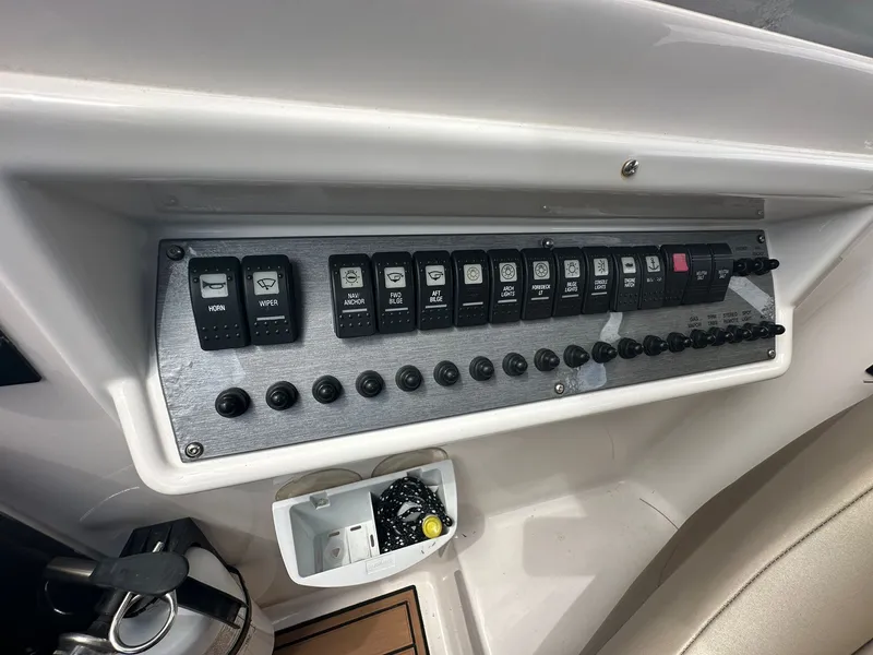 Slide: The Image of Control panel of a 2014 Regal 30 Express with various switches and buttons. - 18