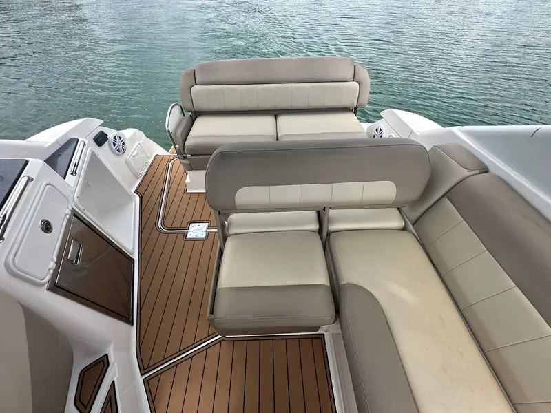 Slide: The Image of The image shows the cockpit of a 2014 Regal 30 Express with beige upholstery. - 17