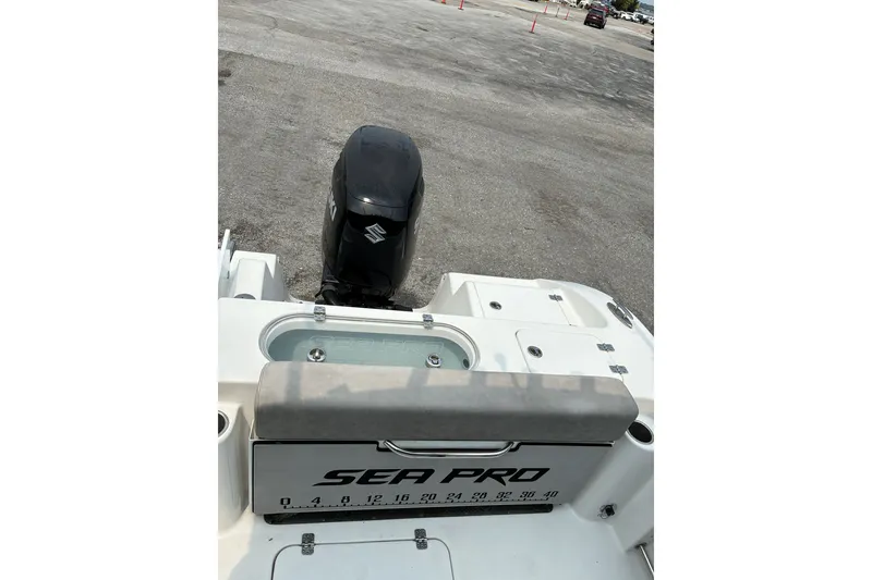 Slide: The Image of 2023 Sea Pro 242 Center Console boat with Suzuki outboard motor, rear view. - 6