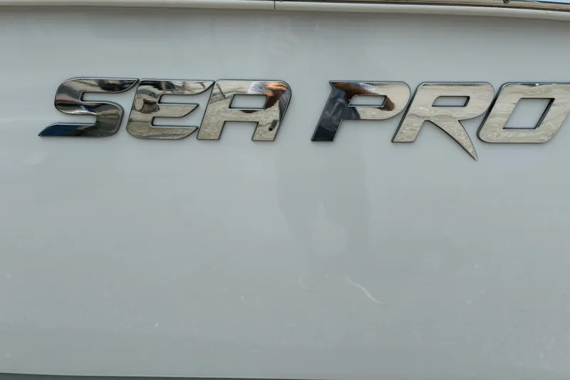 Slide: The Image of Sea Pro 242 Center Console 2023 boat logo on white surface. - 10