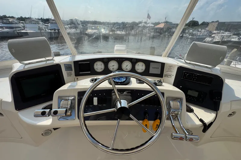 Slide: The Image of Helm of 2005 Silverton 34 Convertible yacht with steering wheel and navigation instruments. - 28