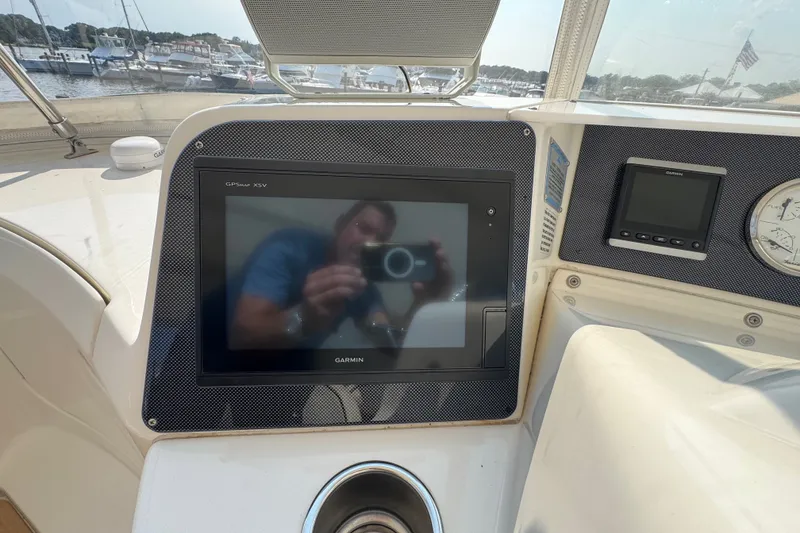 Slide: The Image of 2005 Silverton 34 Convertible helm with Garmin GPS display and gauges. - 30