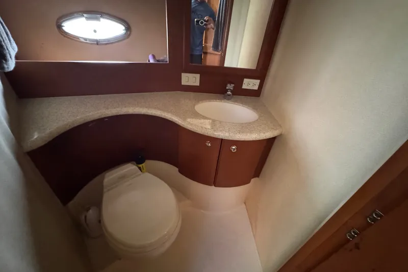 Slide: The Image of Bathroom interior of 2005 Silverton 34 Convertible yacht with sink and toilet. - 42