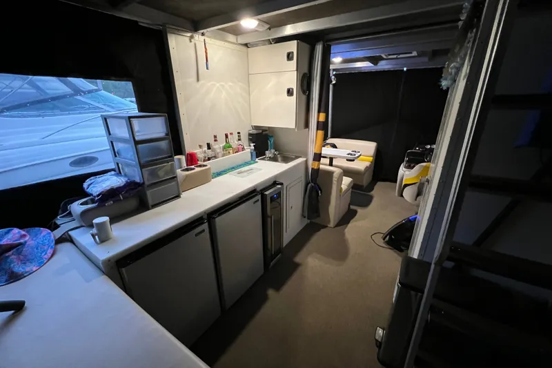 Slide: The Image of Interior of 2007 TRACKER MARINE Party Hut 30 with kitchenette and seating area. - 17