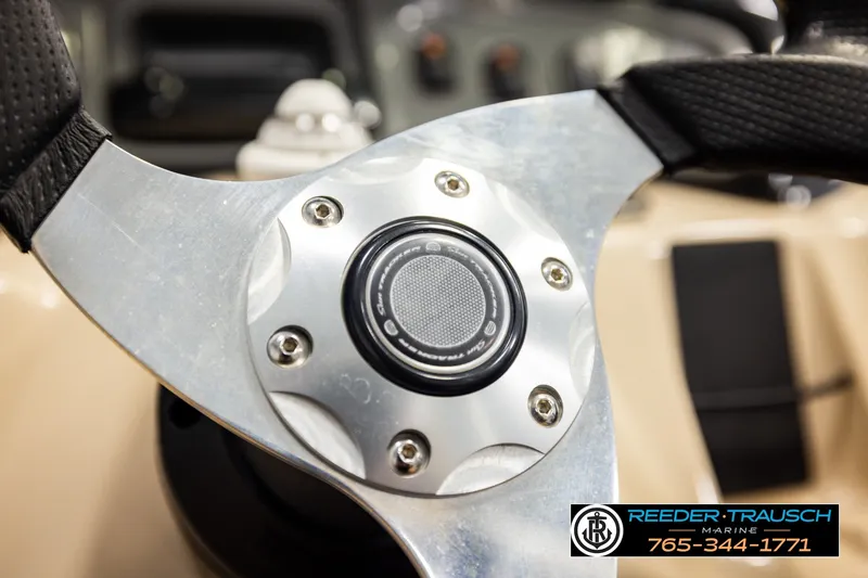 Slide: The Image of Steering wheel of 2019 SUNTRACKER 20 DLX boat, featuring sleek metallic design. - 33