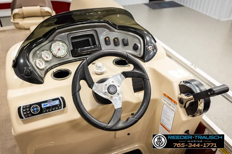 Slide: The Image of Steering console of 2019 SUNTRACKER 20 DLX boat with gauges and controls. - 32