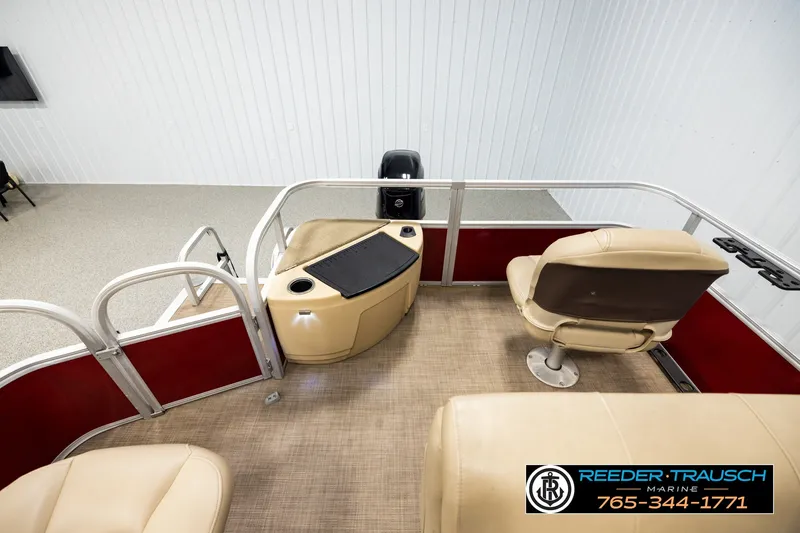 Slide: The Image of 2019 SUNTRACKER 20 DLX boat interior with beige seating and red paneling. - 15