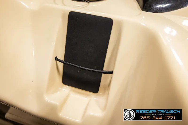 Slide: The Image of 2019 SUNTRACKER 20 DLX boat detail with black panel and bungee cord. - 40