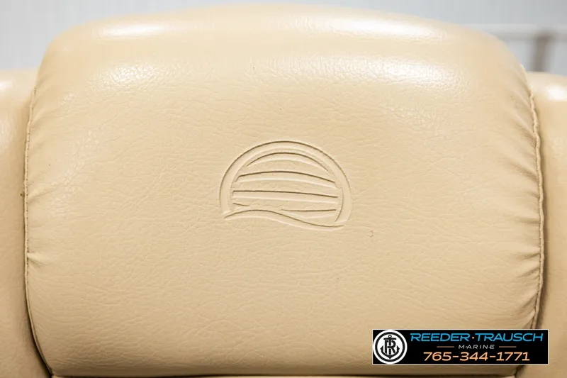 Slide: The Image of Beige leather seat with embossed logo on a 2019 SUNTRACKER 20 DLX boat. - 43