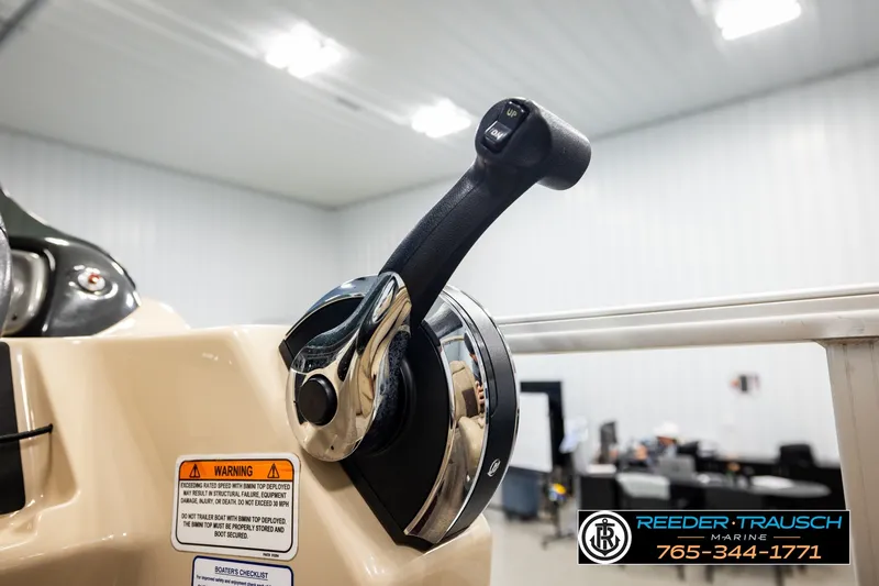 Slide: The Image of Close-up of 2019 SUNTRACKER 20 DLX boat throttle control in a showroom. - 41