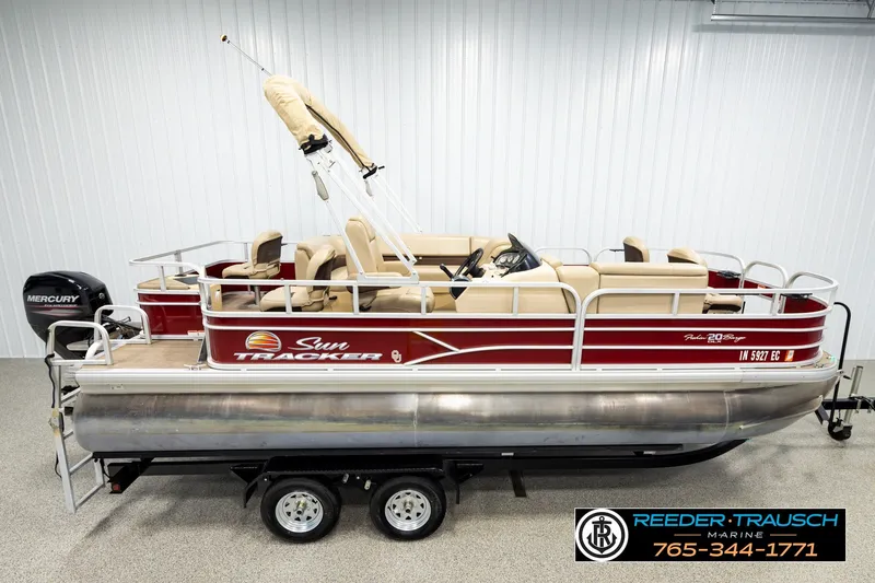 The Image of 2019 SUNTRACKER 20 DLX pontoon boat with Mercury engine on trailer. - 1