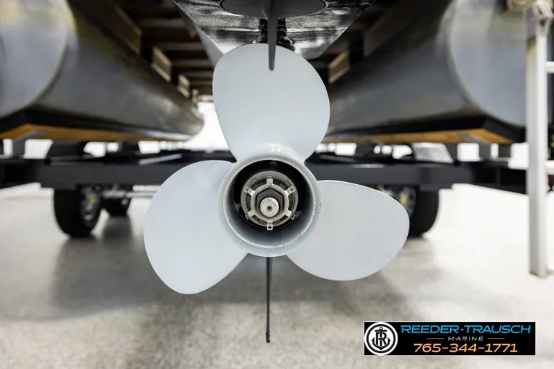 Slide: The Image of Close-up of a 2019 SUNTRACKER 20 DLX boat propeller on a trailer. - 52
