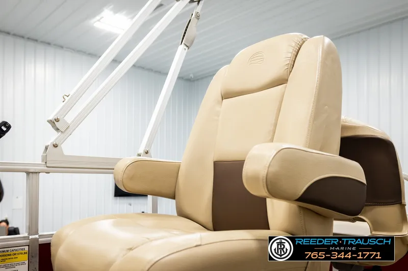 Slide: The Image of Luxurious seating on 2019 SUNTRACKER 20 DLX boat, featuring beige upholstery and armrests. - 42