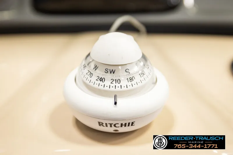 Slide: The Image of Ritchie compass on 2019 SUNTRACKER 20 DLX boat, featuring Reeder-Trausch Marine branding. - 39